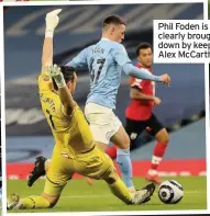  ??  ?? Phil Foden is clearly brought down by keeper Alex McCarthy