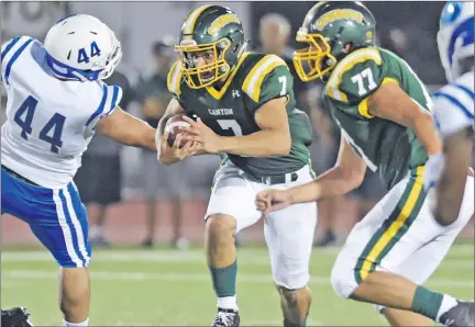  ?? Dan Watson/For The Signal ?? Canyon quarterbac­k Shawn Gallagher (7) runs through the line with the assistance of Justin Swanson (77) against Burbank High earlier this season.