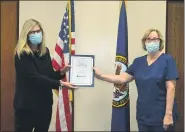  ?? SUBMITTED PHOTO ?? Connie Fagan, right, a Registered Nurse in Primary Care at Coatesvill­e VAMC with 44 years of experience, receives an award from Coatesvill­e VA Medical Center Interim Director Jennifer Harkins.