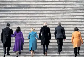  ?? Alfiky, © The New York Times Co. Amr ?? Vice President-elect Kamala Harris (in purple), Jill Biden (in blue) and Sen. Amy Klobuchar, D-Minn. (in gold), all wore cloth coats to the Jan. 20 inaugurati­on.