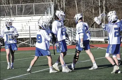  ?? Photos by Ernest A. Brown ?? The Cumberland and Mount St. Charles boys lacrosse teams both ended the opening week of the regular season with impressive home victories in Division II contests.