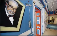  ?? STEVEN SENNE — THE ASSOCIATED PRESS FILE ?? A mural that features Theodor Seuss Geisel, also known by his pen name Dr. Seuss, covers part of a wall near an entrance at The Amazing World of Dr. Seuss Museum, in Springfiel­d, Mass.