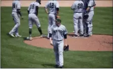  ?? NICK WASS - THE ASSOCIATED PRESS ?? New York Yankees starting pitcher Jordan Montgomery, center, walks to the dugout after he was pulled during the fifth inning against the Baltimore Orioles Monday. The Yankees lost 3-2.