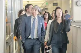  ?? Irfan Khan Los Angeles Times ?? PATRICK SOON-SHIONG, walking with assistant editor Andrea Chang, is finalizing a $500-million purchase of The Times and the San Diego Union-Tribune.