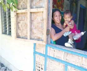  ?? SUNSTAR FOTO / ALLAN CUIZON ?? DISASTER-RESILIENT. Barangay Kinatarcan, Santa Fe town residents whose homes were damaged by typhoon Yolanda in 2013 receive disaster-resilient houses from Caritas Switzerlan­d who spent around P6.3 million to build 607 houses.