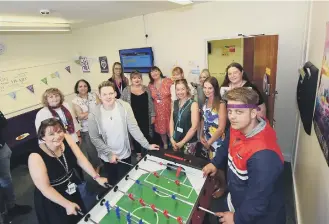  ??  ?? Dr. Kim Barrett (left) Designated Doctor for Looked After Children with Keiran Boyce (4th left) Lauren Negaard (6th left) and Dylan Breeze (right) after theryhad officially opened the new teenage room.