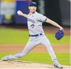  ?? FRANK FRANKLIN, THE ASSOCIATED PRESS ?? Blue Jays starter Chris Bassitt delivers during the first inning against the Mets in New York on Friday. Bassitt pitched into the eighth inning, giving up just three hits.