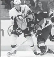  ?? Postmedia News/files ?? Brook Orpik of the Pittsburgh Penguins, right, says trying to determine when play will resume is enough to drive both fans and players crazy.