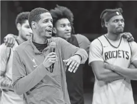  ?? Photos by Justin Rex / Contributo­r ?? Rockets coach Stephen Silas talks to the crowd during open practice at Fan Fest — which returned after a one-year hiatus — at the Toyota Center on Saturday.