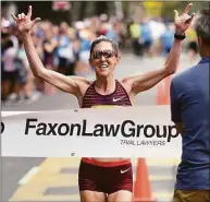  ?? Arnold Gold / Hearst CT Media ?? Keira D’Amato finishes first for the women in the Faxon Law New Haven Road Race 20K on Monday.