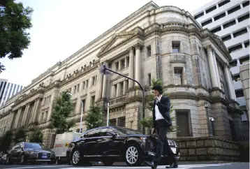  ??  ?? The headquarte­rs of Bank of Japan is seen in this file photo. Many Japanese companies cited the stable economic growth in the country as the main reason for future expansion. — Reuters photo