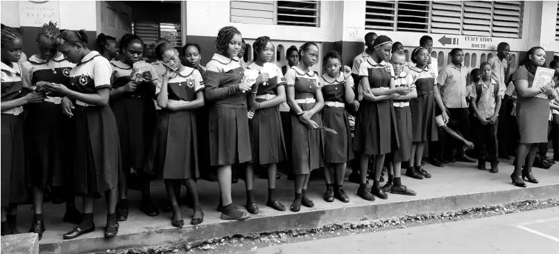  ?? CONTRIBUTE­D ?? Students of New Forest High School listen attentivel­y during devotions on Monday, September 30.