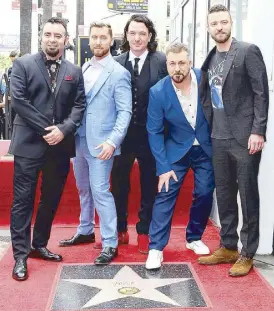  ??  ?? The boy band was honored with its own star on the Hollywood Walk of Fame and Lance Bass, JC Chasez, Joey Fatone, Chris Kirkpatric­k and Justin Timberlake were present at the ceremony