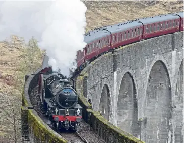 ?? ?? ICONIC: The Jacobite steam train on the Glenfinnan Viaduct. Picture by Sandy McCook.