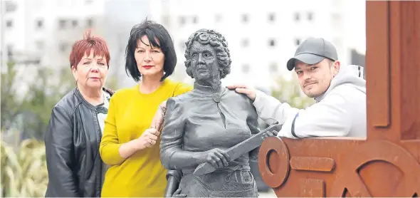  ??  ?? Irene Baxter, Jayne Kelly and Myles McCallum of the Village of Lochee Partnershi­p, pictured at the Jute Women sculpture, have vowed to keep up the campaign.