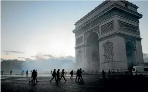  ?? AP ?? Riot police take control at the Arc de Triomphe during a demonstrat­ion against rising the fuel taxes.