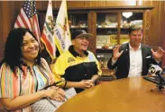  ?? Michael Macor / The Chronicle ?? Alberto Carrillo (center), with his wife, Francisca Carrillo, is honored by Mayor Mark Farrell.