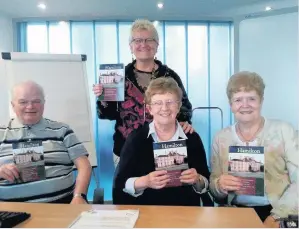  ??  ?? Read all about it John Hutton, Janette Cameron, Hazel Brown (standing) and Janette Broadley