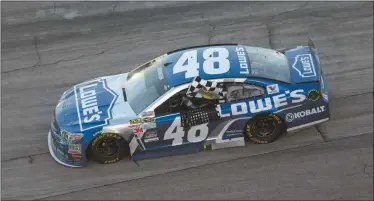  ?? Tim Sharp/AP ?? Jimmie Johnson (48) drives with the checked flag after winning the NASCAR Sprit Cup Series auto race at Texas Motor Speedway in Fort Worth, Texas, Sunday, Nov. 8, 2015.