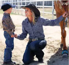  ??  ?? Introducin­g horsemansh­ip to their kids has been a labor of love for Shali and Phy Lord, spending their days in the barn while keeping the hard work fun.