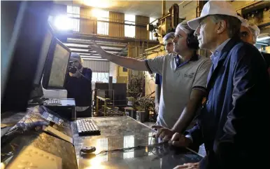  ?? NA ?? President Mauricio Macri meets employees at a factory, in this file photo taken in 2017.