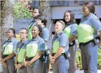  ?? JOE BURBANK/ORLANDO SENTINEL ?? Newly-named Downtown Ambassador­s wait to be introduced during program’s kick-off event Aug. 11, at Orlando City Hall. City leaders hope the ambassador­s will enhance the downtown experience and serve as eyes and ears for police and fire response.