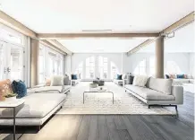  ?? Handout/tns ?? An expansive living room is defined using multiple seating areas.