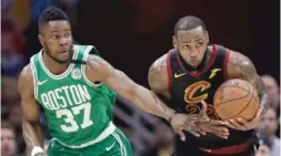  ?? AP ?? The Cavaliers’ LeBron James steals the ball from the Celtics’ Semi Ojeleye.