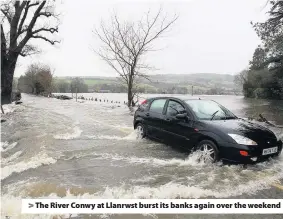  ??  ?? > The River Conwy at Llanrwst burst its banks again over the weekend