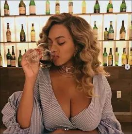  ??  ?? Beyoncé’s Instagram post shows her having a glass of wine. And then the comments and judgments followed.