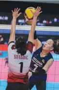  ?? ?? PRINCESS ROBLES of National University challenges the defense of a University of the Philippine­s defender yesterday in the UAAP Season 84 women's volleyball tournament. (UAAP Media)