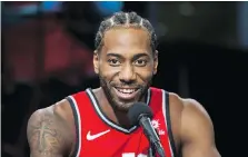  ?? ERNEST DOROSZUK ?? Kawhi Leonard speaks during Raptors Media Day in Toronto on Monday. He kept his thoughts on his past in San Antonio and pending free agency close to his vest, noting his focus is on this season.