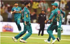  ?? Ahmed Kutty/Gulf News ?? Pakistan’s Imad Wasim celebrates the wicket of D’Arcy Short during the first T20 at Zayed Stadium in Abu Dhabi.