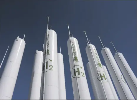  ?? AP PHOTO/BERNAT ARMANGUE ?? Hydrogen storage tanks are visible at the Iberdrola green hydrogen plant in Puertollan­o, central Spain, on March 28.