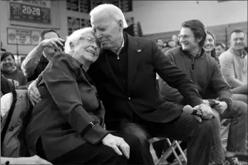  ?? MARY ALTAFFER / ASSOCIATED PRESS FILE ?? Former Vice President Joe Biden hugs a supporter during a campaign rally Feb. 9 in Hudson, N.H.