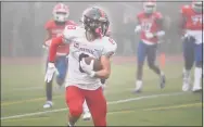  ?? Brian A. Pounds / Hearst Connecticu­t Media ?? Cromwell/Portland’s Theodore Williams runs during Saturday’s Class S title game against Bloomfield.