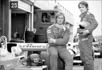  ?? Photo by The Associated pPess ?? Chris Hemsworth (left) plays James Hunt and Daniel Bruhl plays Niki lauda in Ron Howard’s Formula One film “Rush.” —