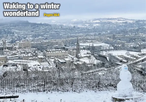  ??  ?? The snowy scene across Bath – featuring a snowman wearing a face mask – taken by Phoebe Millard