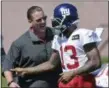  ?? SETH WENIG — ASSOCIATED PRESS ?? Giants head coach Ben McAdoo, left, talks with Odell Beckham, Jr. during training camp in East Rutherford, N.J.