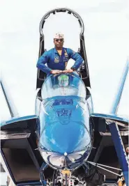  ?? ?? Blue Angel lead solo pilot Lt. Cmdr. Julius “Whiskers” Bratton in the cockpit of the Blue Angel’s No. 5 Boeing F/A-18 Super Hornet.