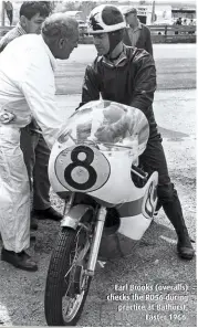  ??  ?? Earl Brooks (overalls) checks the RD56 during practice at Bathurst, Easter 1966.