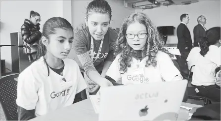  ?? DAVID BEBEE WATERLOO REGION RECORD ?? Abraham Erb Public School Grade 6 students Preet Dosanjh, left, and Grace Trowbridge are helped by Actua instructor Aybauke Ozel while using Scratch2 software. The students were working in Google’s first community space in Canada at its Kitchener...