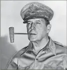  ?? ASSOCIATED PRESS ?? A giant corncob pipe became the trademark of Gen. Douglas MacArthur and his World War II Pacific campaigns. Here he's shown in Manila in 1945.