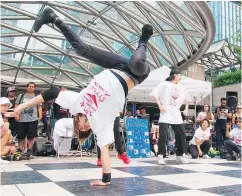  ??  ?? The Vancouver Street Dance Festival draws on a tradition of break-dancers working on their moves on the empty ice rink under Robson Street.