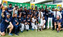  ?? AP ?? Sri Lankan players and officials pose with the trophy after they became the first Asian team to win a Test series in South Africa. —