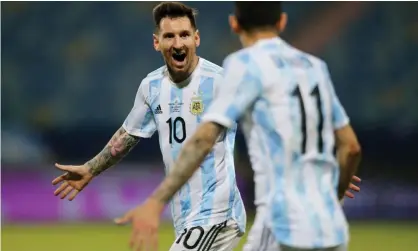  ?? Photograph: Diego Vara/Reuters ?? Lionel Messi celebrates Argentina’s third goal with Angel Di Maria.