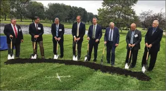  ?? STEVE BAKER / STAFF ?? Emerson and community officials participat­e in a ceremonial groundbrea­king on a $130 million expansion and renovation project at the company’s Sidney facility.