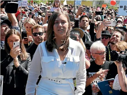  ?? GETTY IMAGES ?? Brittany Higgins arrives outside Parliament House in Canberra for a rally named March4Just­ice.