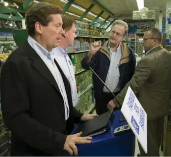  ?? ADRIAN WYLD/THE CANADIAN PRESS FILE PHOTO ?? A voter questions then PC leader John Tory about religious school funding during the 2007 provincial campaign.