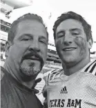  ?? KEN MARCHIOL ?? Santino Marchiol and his father, Ken, after the Texas A&amp;M spring game.